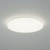 Round white ceiling light fixture emitting a soft glow on a plain ceiling.