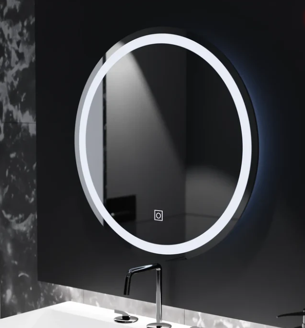 Illuminated circular mirror with edge lighting mounted on a dark wall above a white sink and chrome faucet.