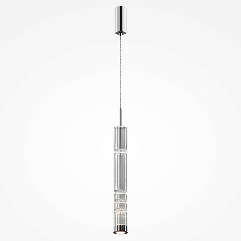 Modern crystal pendant light hanging from the ceiling with stacked glass cylinders and chrome hardware at the top and bottom, illuminating softly.