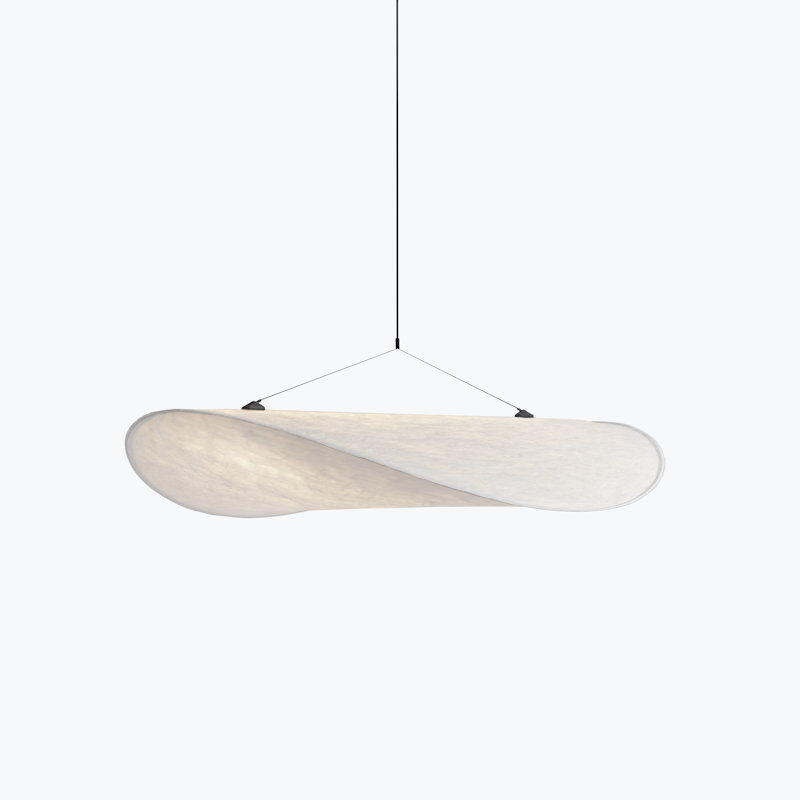 Minimalist white curved pendant light hanging from a thin cord against a pale background.
