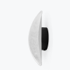 Side view of a crescent-shaped white wall lamp with a black circular mount (wall sconce).