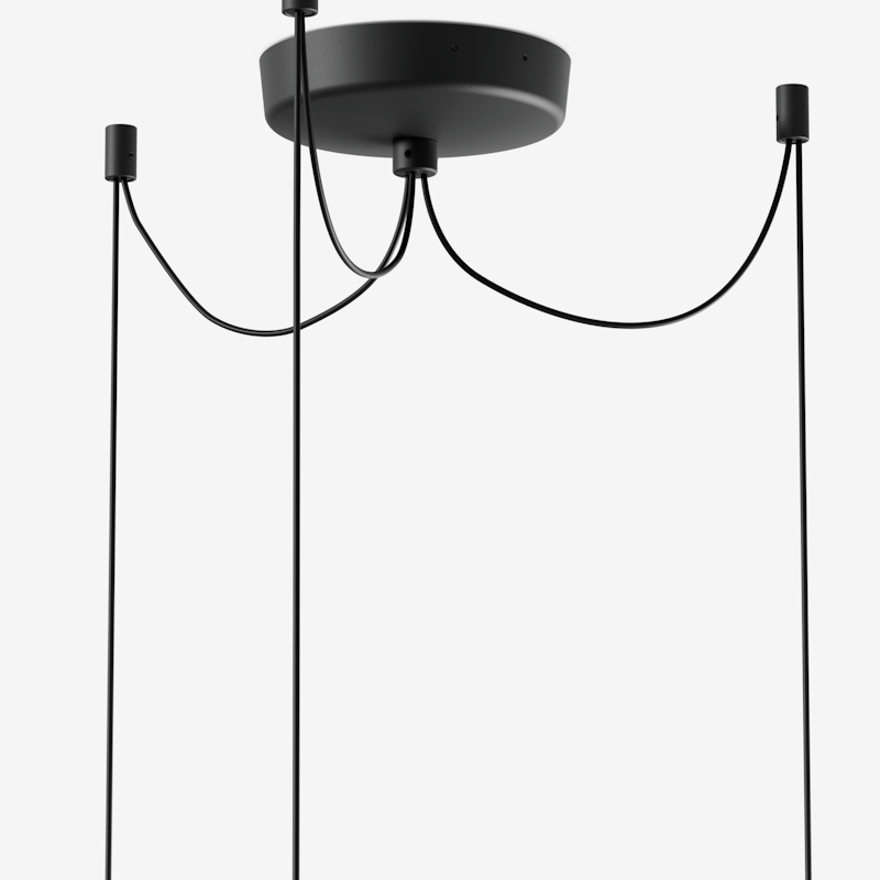 Minimalist black pendant light with a round ceiling canopy and four long cords ending in slim fixtures against a white background