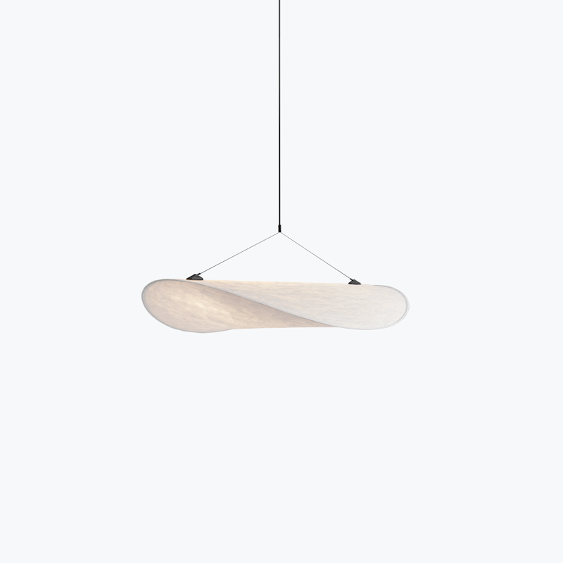 Wooden, curved pendant light suspended by a thin black cord from the ceiling