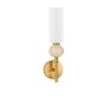 Gold wall sconce with a white cylindrical shade and a wood bead accent on the arm, mounted to a brass plate.