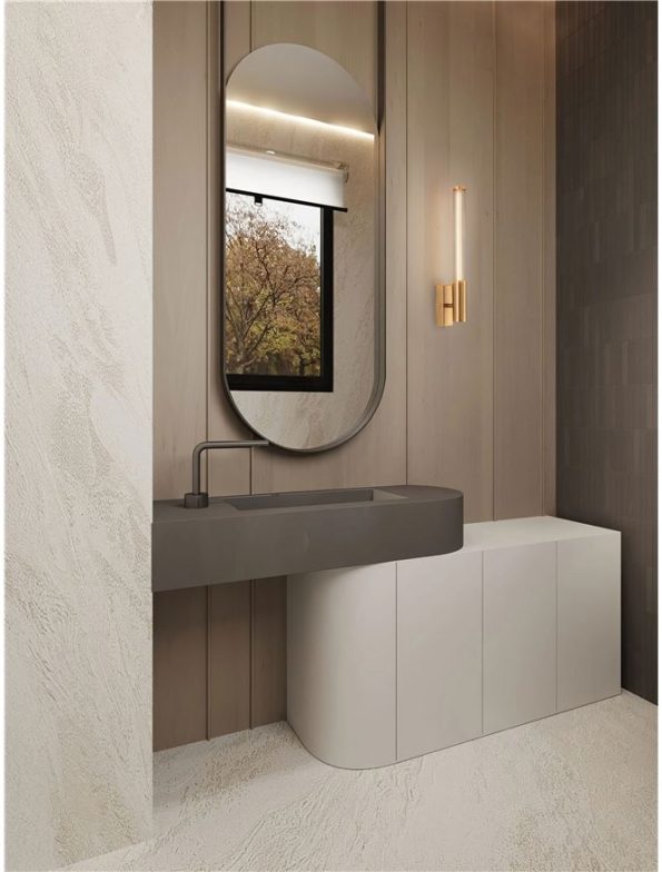 Modern bathroom vanity with an oval mirror, gray sink, and curved white storage cabinet beneath wood-paneled walls.