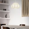 Minimalist dining area with a white table, wooden chairs, a round pendant lamp, and built-in shelves with decorative items.