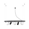 Four-bulb pendant light with white globe shades and black accents hanging from cables.
