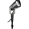Black outdoor spotlight mounted on a stake with a hinged head for garden lighting