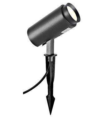Black outdoor garden spotlight on a ground stake with an adjustable cylindrical head for landscape lighting.